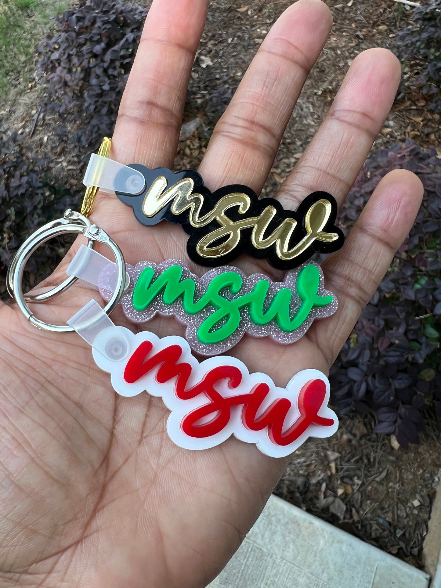 Acrylic double layer keychain featuring 'MSW' credential badge design.