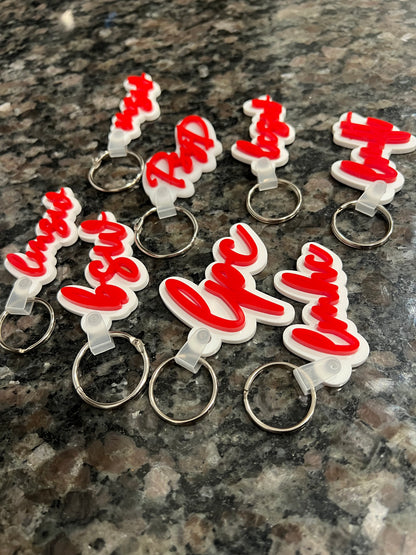 Red and White acrylic MH credential keychains.